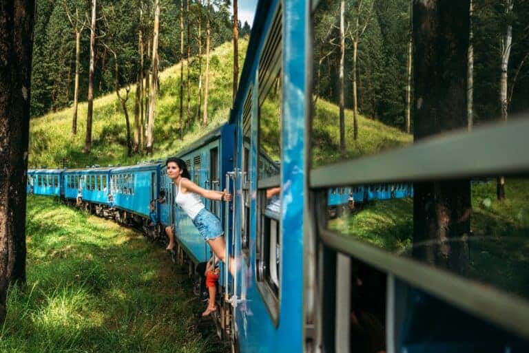 Travel by train. The girl travels by train to beautiful places